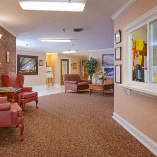 A cozy waiting area with comfortable seating and warm lighting.