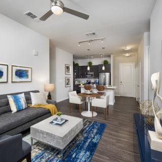 A modern open-plan living and dining area with stylish furniture and decor.