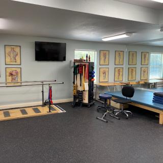 A well-equipped training room designed for physical therapy and exercise.