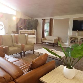A cozy and modern living room with comfortable seating and stylish decor.