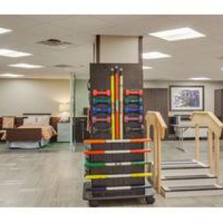 A rehabilitation facility with exercise equipment and resistance bands.