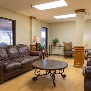 A cozy living room setting featuring comfortable leather sofas and a stylish coffee table.