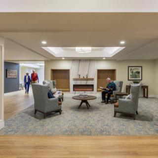 A cozy and inviting lobby area, featuring comfortable seating arrangements and a warm ambiance.