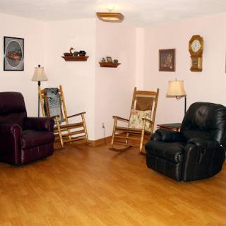 A cozy living room featuring a mix of seating options and home decor.