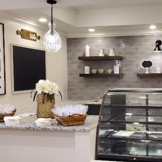 A modern caf interior showcasing a beautifully arranged counter and elegant decor.