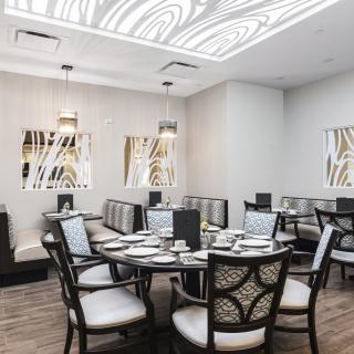 A modern and elegant restaurant dining room with stylish seating arrangements.