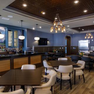A modern restaurant interior with stylish lighting and comfortable seating.
