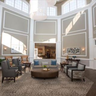 A stylish and inviting lobby area with modern furniture and plenty of natural light.