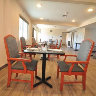 An indoor dining area with neatly arranged tables and chairs.