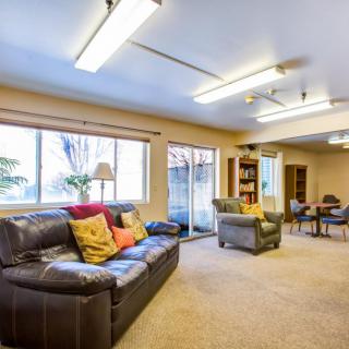 A spacious living room with comfortable seating and ample natural light.