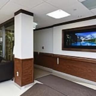 A modern hallway with artwork on the wall.