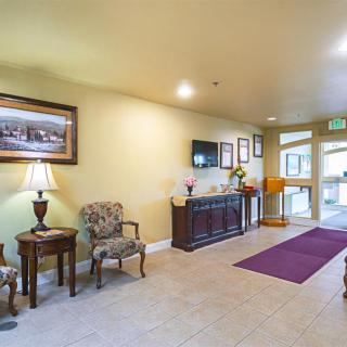 A well-lit lobby with comfortable seating and decorative elements.