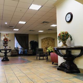 A stylish lobby featuring decorative furniture and a warm ambiance.