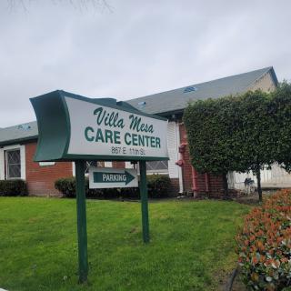 A view of the Villa Maria Care Center, showcasing its welcoming sign and well-kept surroundings.