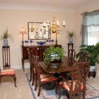 A classic dining room with elegant furniture and decor.