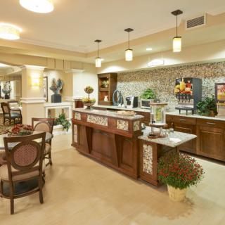 A modern kitchen with an island counter and elegant interior design.