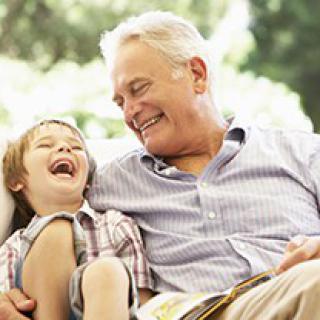A grandfather and grandson sharing a joyful moment together.
