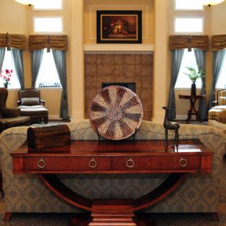 A beautifully arranged living room featuring elegant furniture and decorative elements.