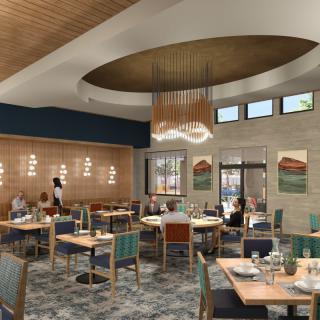 A modern restaurant interior with stylish lighting and seating arrangements.