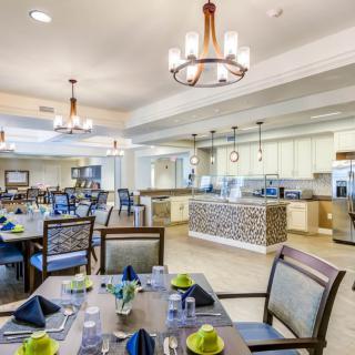 Elegant dining room with neatly set tables and modern decor.