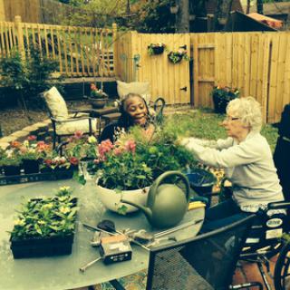 A joyful day spent gardening with friends in a beautiful outdoor setting.