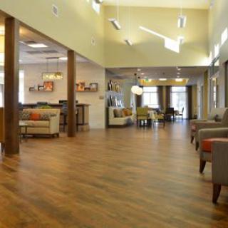 A spacious and well-lit lobby area with comfortable seating and modern decor.