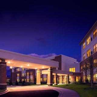 A well-lit building entrance at night.