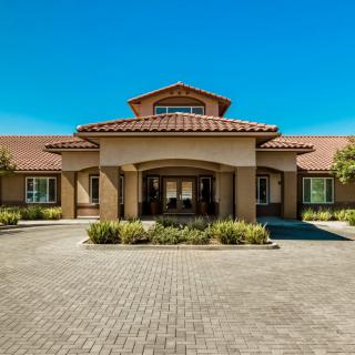 A beautiful residential building with a welcoming entrance and well-maintained landscaping.
