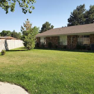 A picturesque view of a suburban house with a well-maintained front yard.