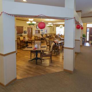 A decorated dining area with tables and chairs.