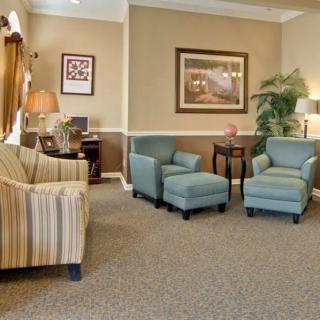 A cozy living room with comfortable seating and elegant decor.