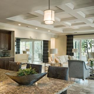 A beautifully designed open-concept living space with modern furnishings and abundant natural light.
