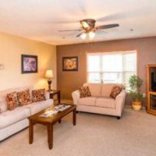 A cozy living room with comfortable seating and warm decor.