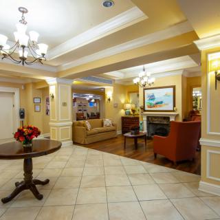 A well-lit lobby area featuring comfortable seating and elegant decor.