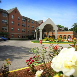 A beautifully landscaped building with an inviting entrance.