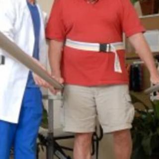 A physical therapist assists a patient during a rehabilitation session.