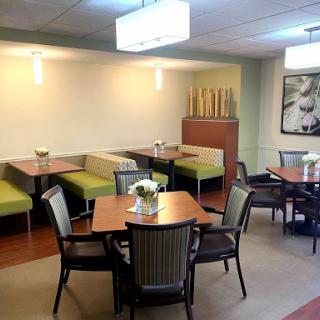 A welcoming dining area featuring modern furniture and a cozy atmosphere.