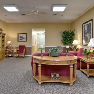 A cozy living room with comfortable seating and warm lighting.