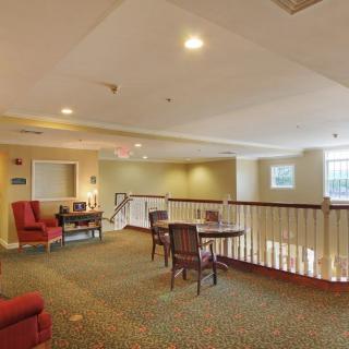 A cozy lounge area with comfortable seating and soft lighting.