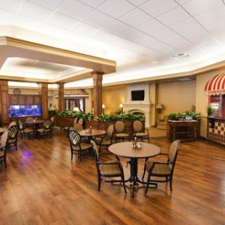 A cozy lounge area featuring comfortable seating and a warm ambiance.