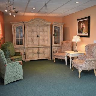 A cozy living room setup featuring elegant furniture and a warm ambiance.