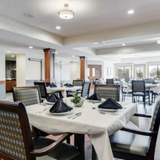 An elegantly set dining room, ready for guests.