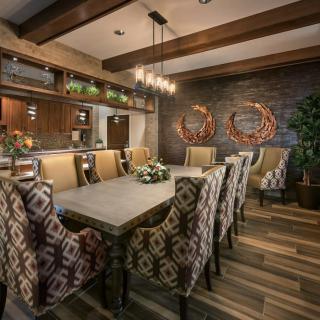 Elegant dining room with wood accents and stylish decor.