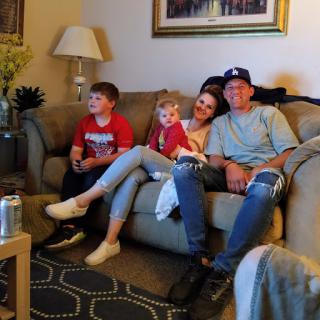 A cozy family moment in the living room, enjoying each other's company.