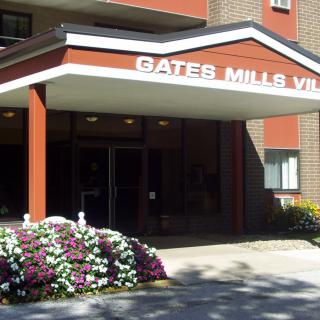 Entrance to Gates Mills Village with floral landscaping.