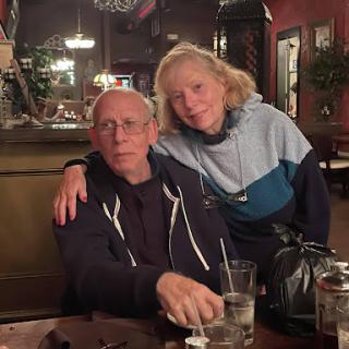 A couple enjoying a moment together in a cozy restaurant.