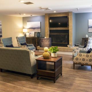 A cozy living room with comfortable seating and warm decor.