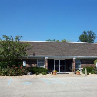 A well-maintained building with a clear blue sky overhead.