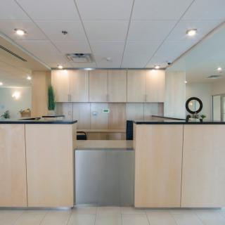 A modern office reception area with a minimalist design.