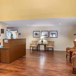 A welcoming hotel lobby with a reception desk and comfortable seating.